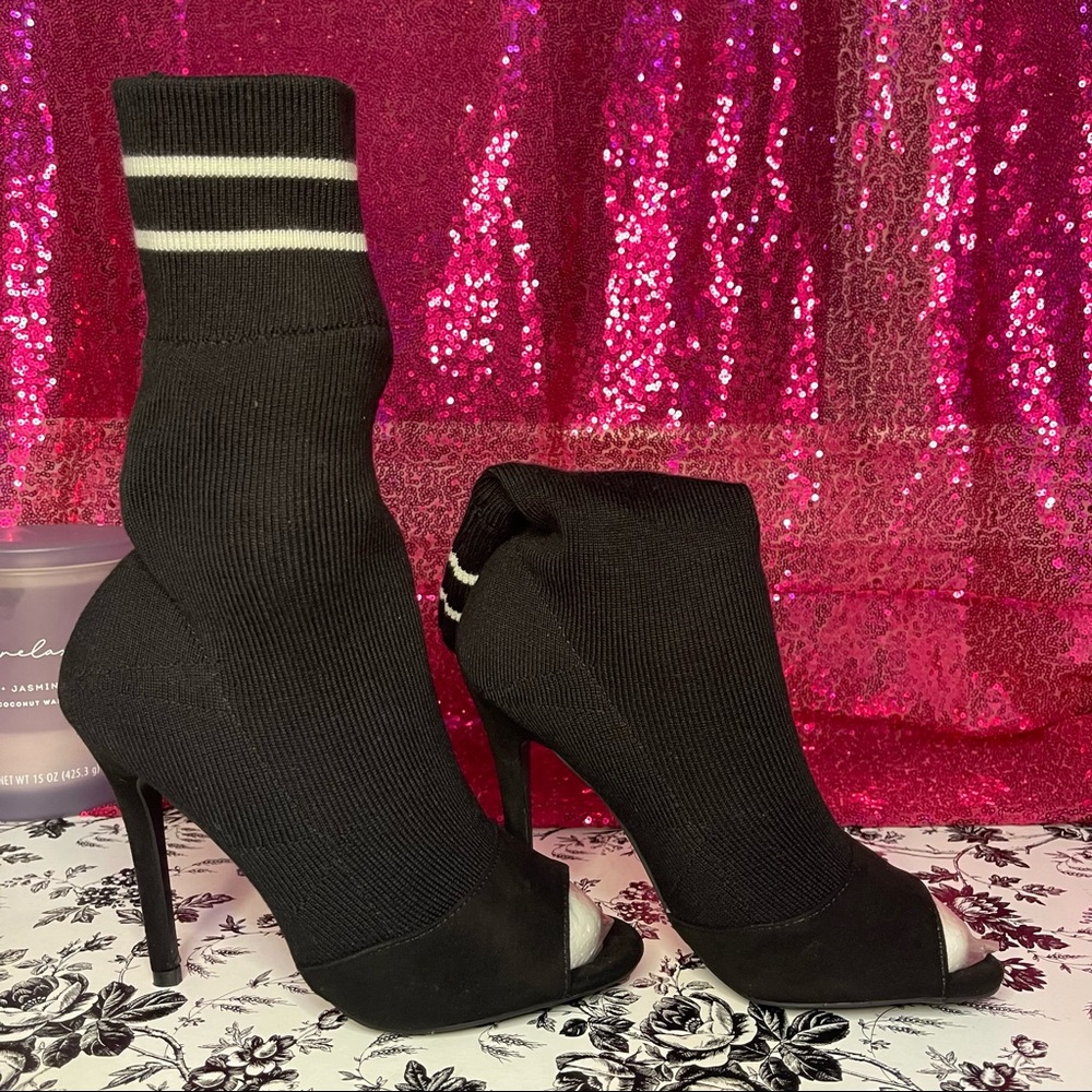Black and white sock style heeled boots